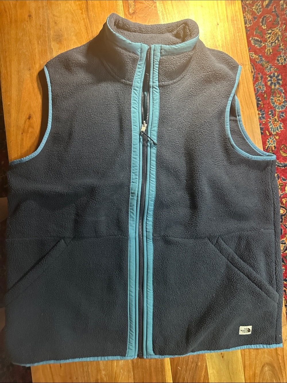 The North Face Navy Fleece Vest with Teal Trim